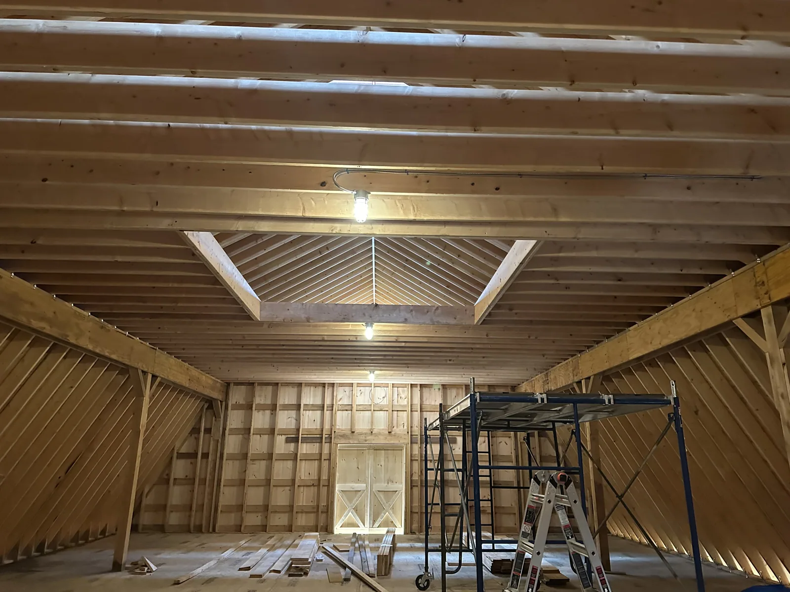 Interior timber framing with skylights and a cathedral ceiling