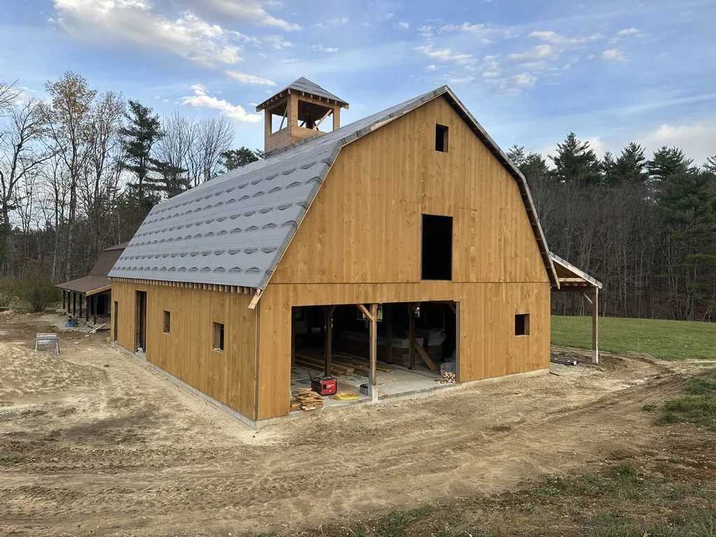 Barn exterior with the cupola and open doors