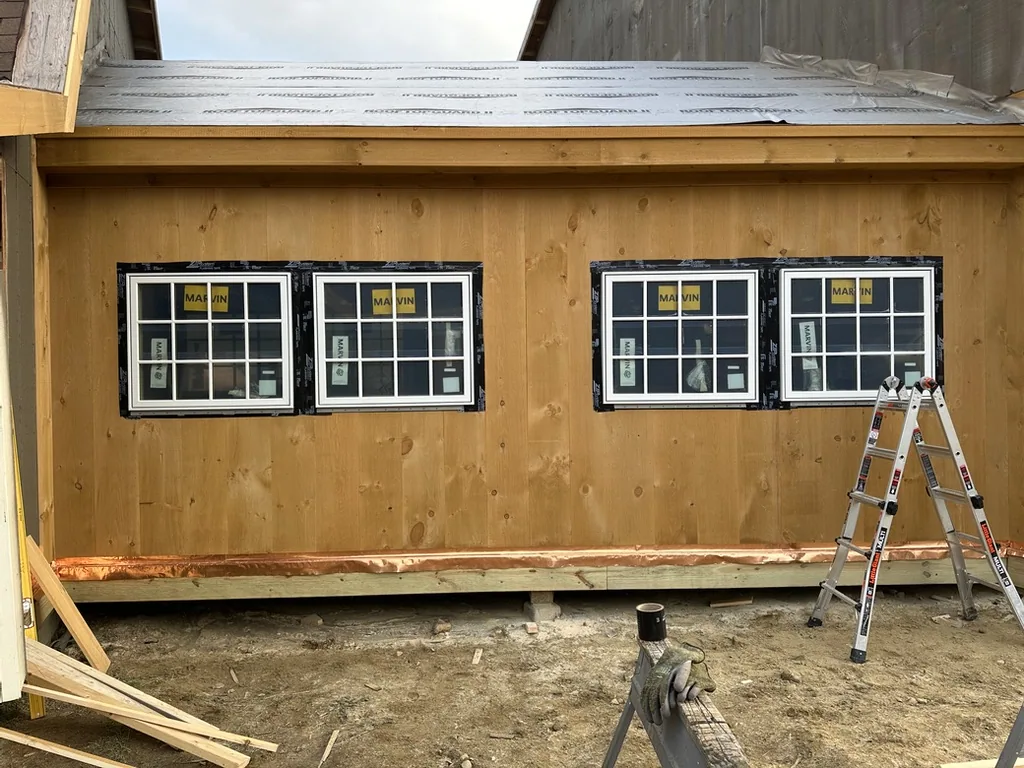 Wall of windows installed in the finished siding