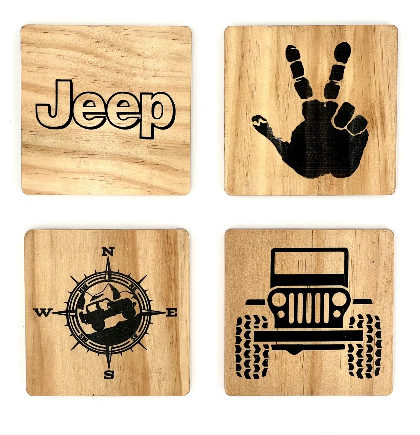 Set of four maple coasters engraved with Jeep motifs.