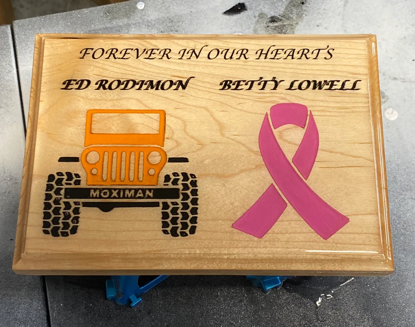 Maple memorial box engraved with a remembrance line, a hand-painted Jeep, and a pink ribbon.