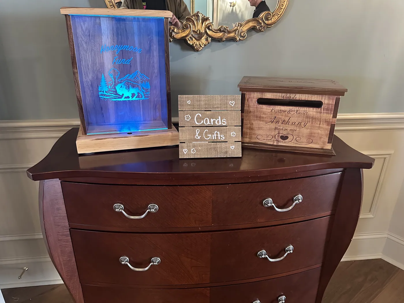 Set of personalized wedding boxes, including a backlit honeymoon fund box.