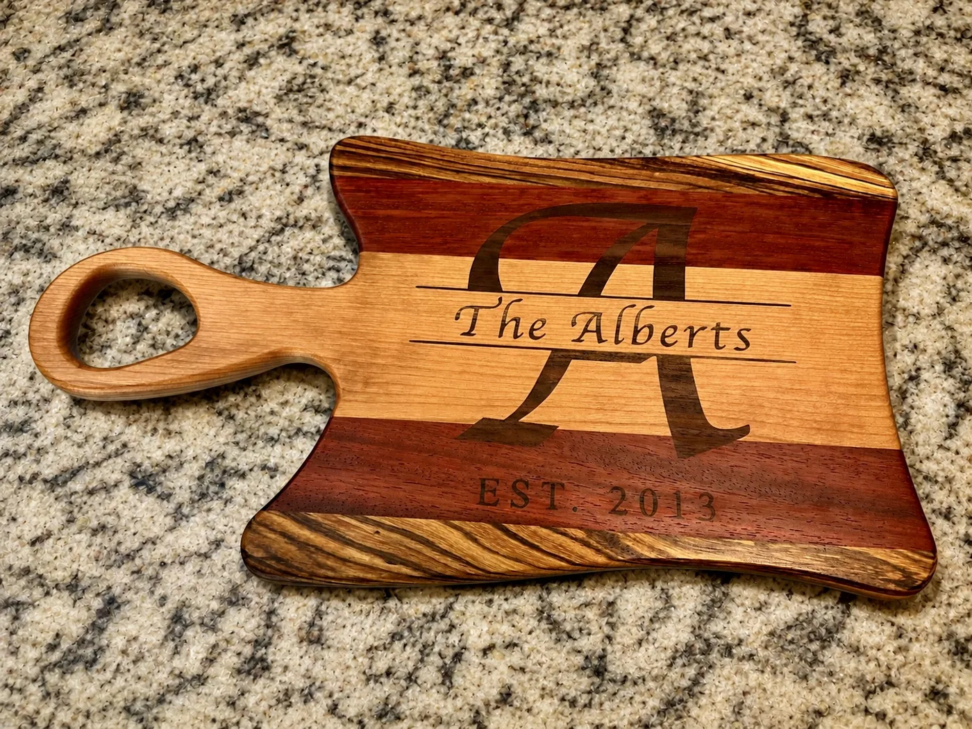 The Alberts family engraved monogram serving board