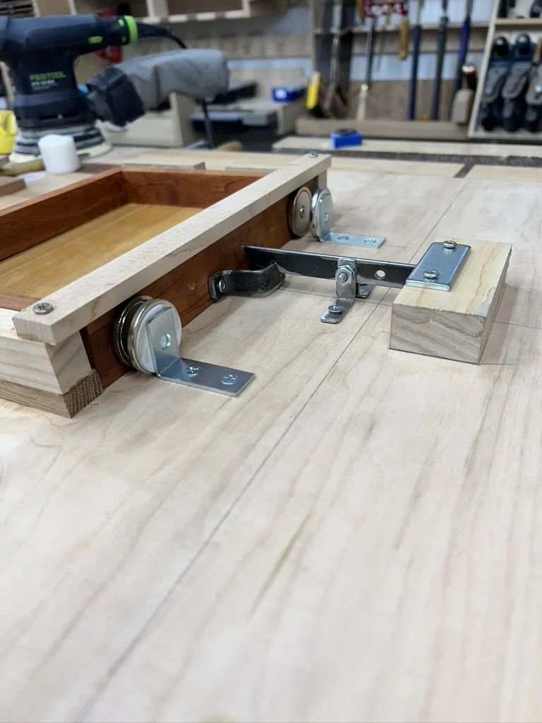 The board set into its maple, walnut, and cherry stand