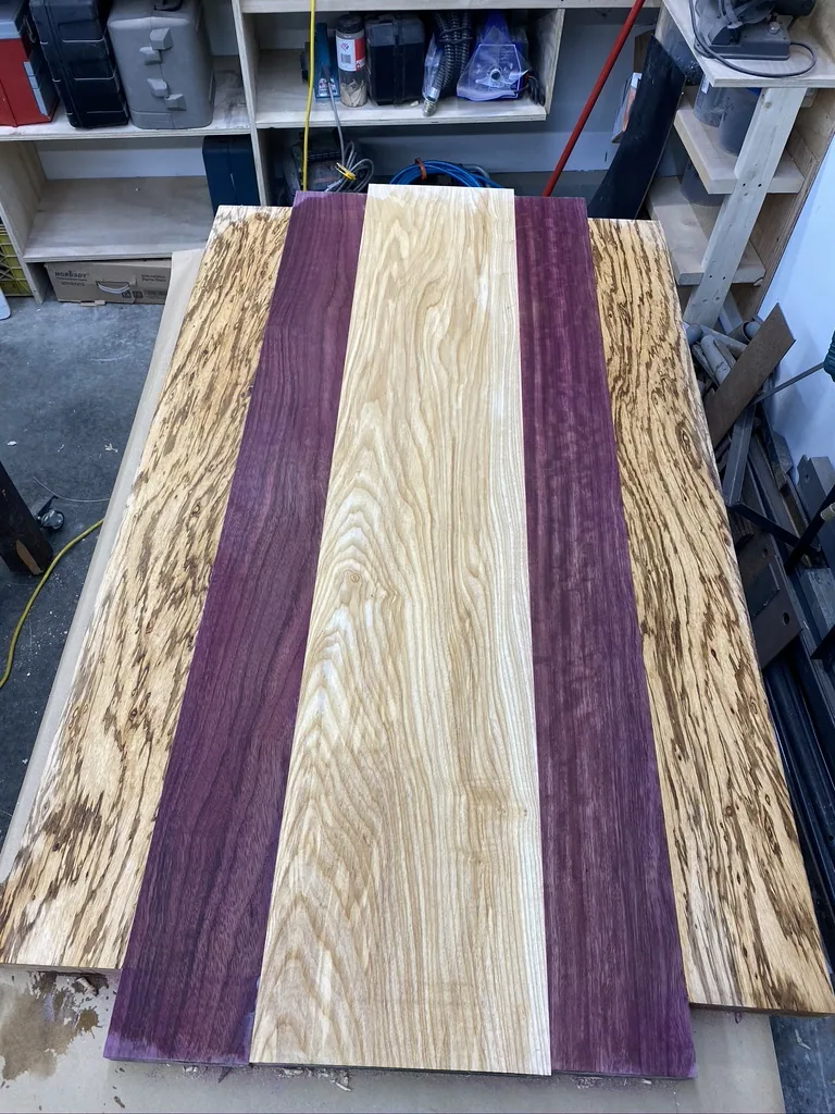 Ash center panel flanked by purpleheart and zebrawood, glued into the tabletop
