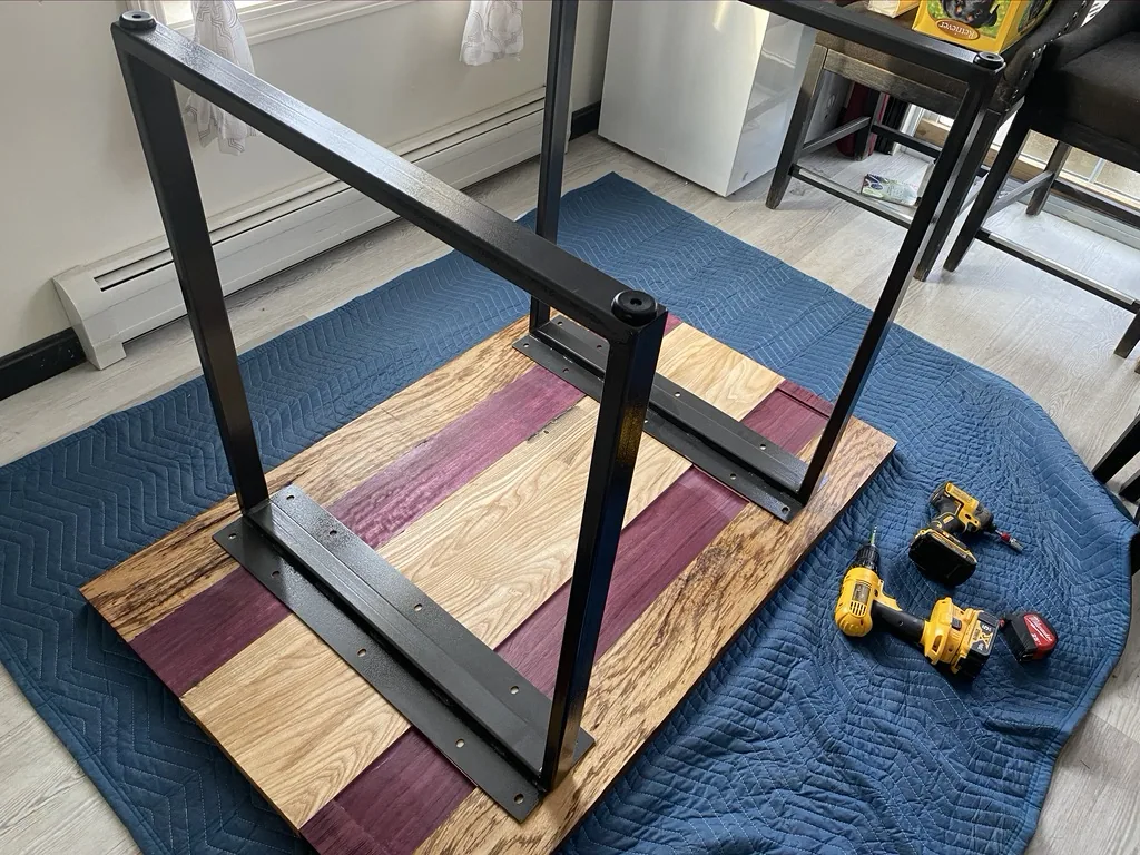 The steel base attached to the underside of the tabletop