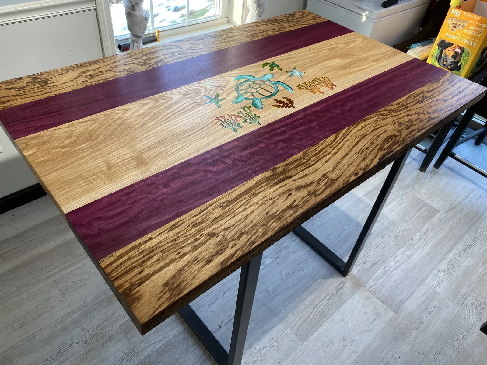 The finished tabletop showing the turtle inlay, purpleheart, and zebrawood under a tung oil sheen